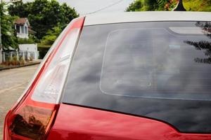 Back view of red car window for sticker mockup photo