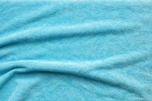 Blue towel fabric texture surface close up background photo