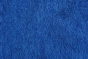 Denim blue jeans texture close up background top view photo