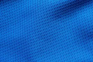 Blue sports clothing fabric football shirt jersey texture close up photo