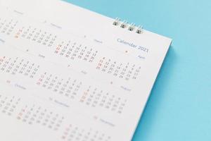 2021 calendar page on blue background business planning appointment meeting concept photo