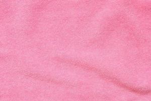 Pink towel fabric texture surface close up background photo