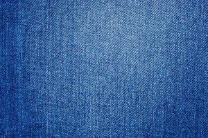 Denim blue jeans texture close up background top view photo