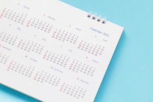 2021 calendar page on blue background business planning appointment meeting concept photo