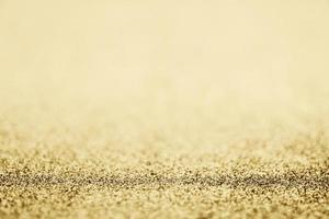 Abstract gold glitter sparkle blurred with bokeh background photo