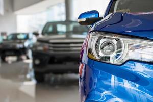 new cars in dealer showroom interior background photo