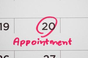 important appointment schedule write on white calendar page date close up photo