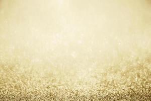 Abstract gold glitter sparkle blurred with bokeh background photo