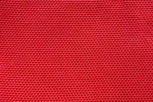 Red fabric cloth texture background close up photo
