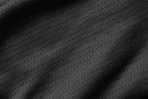 Black sport cloth fabric football shirt jersey texture close up photo