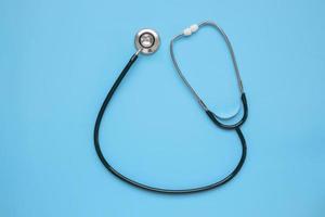 Stethoscope medical equipment on blue background healthcare concept photo