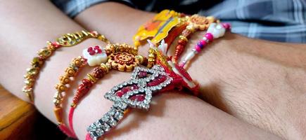 hand of a guy with rakhi tied in wrist in the occasion of rakshabandhan photo