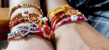 hand of a guy with rakhi tied in wrist in the occasion of rakshabandhan photo