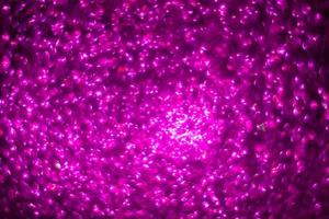 defocused abstract background glittering with bright lilac sparkles. photo