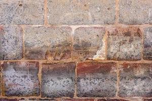 texture of a stone brick wall without finishing photo