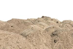 Construction site with heaps of sand. Pile of sand on an isolated white background. copy space. photo