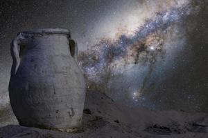 Ancient amphora against the background of the night sky with the milky way, outer space. The concept of astronomy and archeology. Poster, education photo