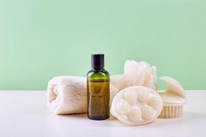 Bathroom Accessories - Shampoo, loofah, towel, bath salt and body brush photo