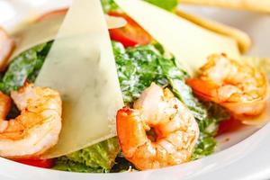 Seafood Caesar Salad with Shrimps, Salad Leaf, Croutons, Cherry Tomato and Parmesan Cheese photo