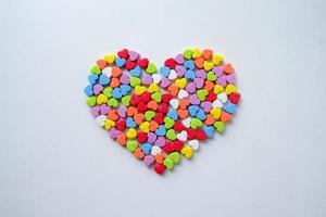 A lot of the little shining colorful hearts in one big heart for Valentine's Day. photo