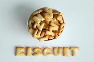 A bowl of cookies with inscription from the cookies on the white background. photo