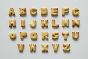 An English alphabet from the cookies on the white background. photo