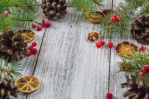 Christmas branches with cones viburnum berries and dry lemon sli photo