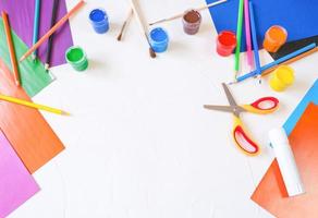 DIY paper rabbit from a roll of toilet paper. Easy craft for kids on white background, simple DIY idea from toilet tube, recycling concept. photo