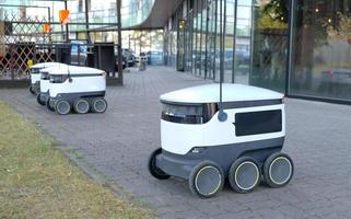 Autonomous delivery robot on Tallinn, Estonia. Estonian company developing autonomous delivery vehicles. Concept of future, technology, unmanned courier robot. photo