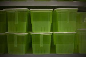 Food containers in store. Plastic boxes. Food storage tanks. Plastic objects. photo