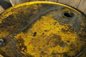 Fuel tank and rust. Steel barrel on street. Hole for receiving fuel. photo