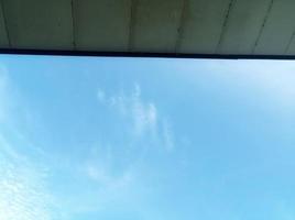 the roof of the building and the clear blue sky in the afternoon photo