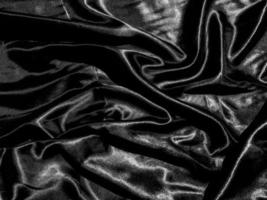 luxury black silk or satin texture background with liquid wave or wavy folds. Wallpaper design photo