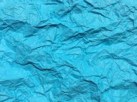 Modern blue crumpled paper texture background for Design. photo