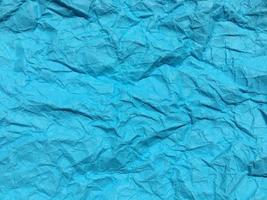 Modern blue crumpled paper texture background for Design. photo