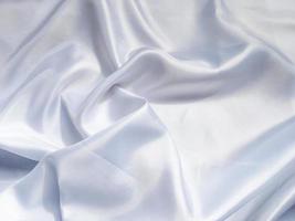 Solf white satin fabric texture background. use as wedding or aniversary day with copy space for design photo