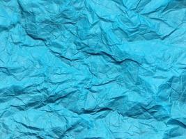 Modern blue crumpled paper texture background for Design. photo