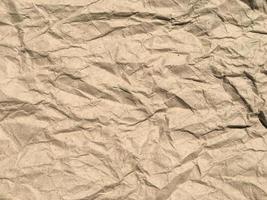 Brown crumpled paper background with copy space for Design. Wrinkled wallpaper Pattern photo