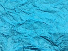 Modern blue crumpled paper texture background for Design. photo