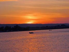 boating sunset escarpment photo