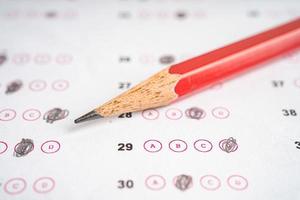 Answer sheets with pencil drawing fill to select choice, education concept. photo