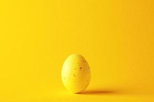 Easter yellow egg on a yellow background. Close up. photo