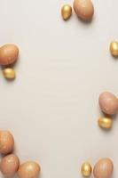 Easter beige eggs on pastel background. Flat lay, copy space. photo