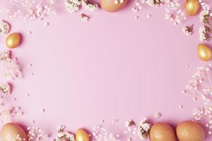 Easter eggs with flowers on pink background. Flat lay, copy space. photo