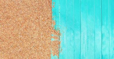 Marine banner. Turquoise wooden planks of pier with beach pebble sand. Travel and tourism. Copy space photo