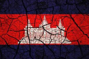Dry soil pattern on the flag of Cambodia. Country with drought concept. Water problem. Dry cracked earth country. photo