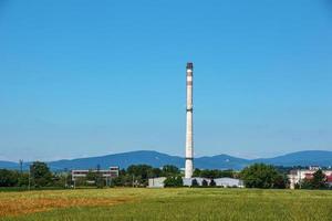 View en exhaust pipe of an industrial plant against the blue sky. The company is not working. There are no exhaust gases. Energy crisis. photo