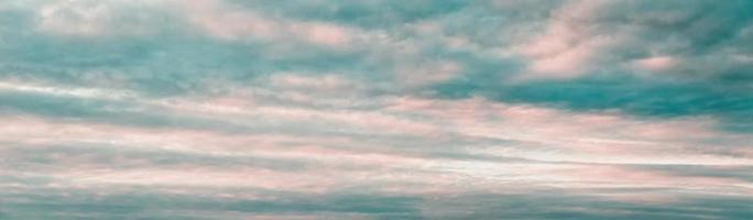 Sunset sky panorama, pink blue clouds background, cloudscape, wide large banner size photo