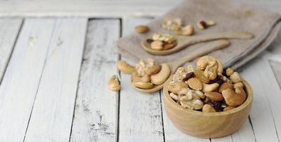 Bowl of mixed nuts with dried berry photo