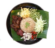 Thai traditional food - Rice seasoned with shrimp paste isolated on white photo